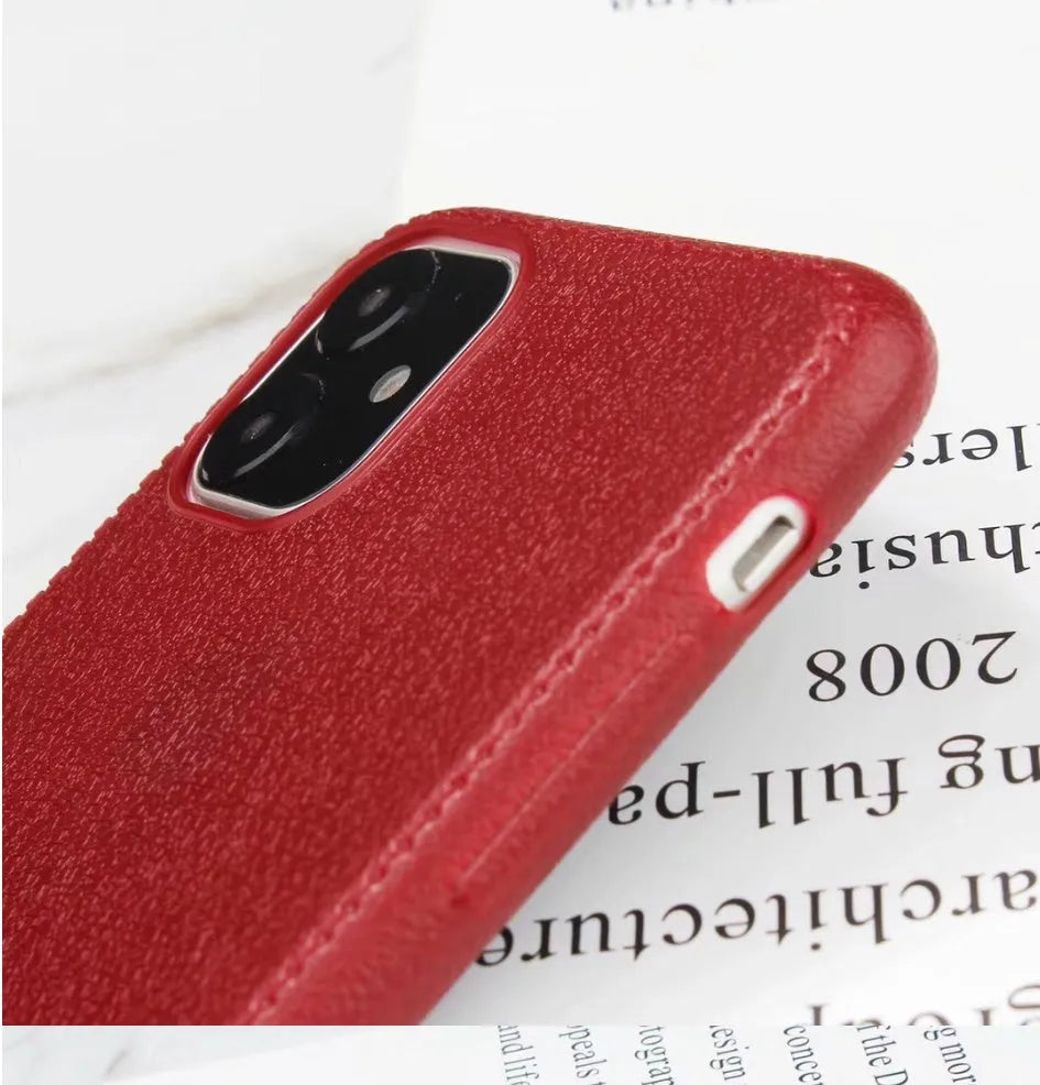 Leather and TPU iPhone case in black, shown on an iPhone.