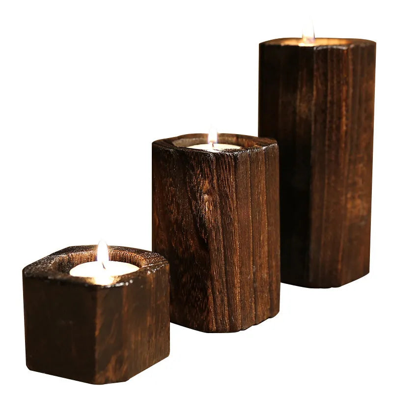 Solid wood candle holder in natural paulownia with charcoal-fired finish, 6x6cm top and 4.5cm candle aperture.