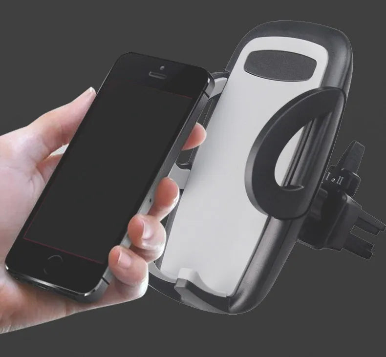 Black plastic universal car phone holder mounted on a car air vent