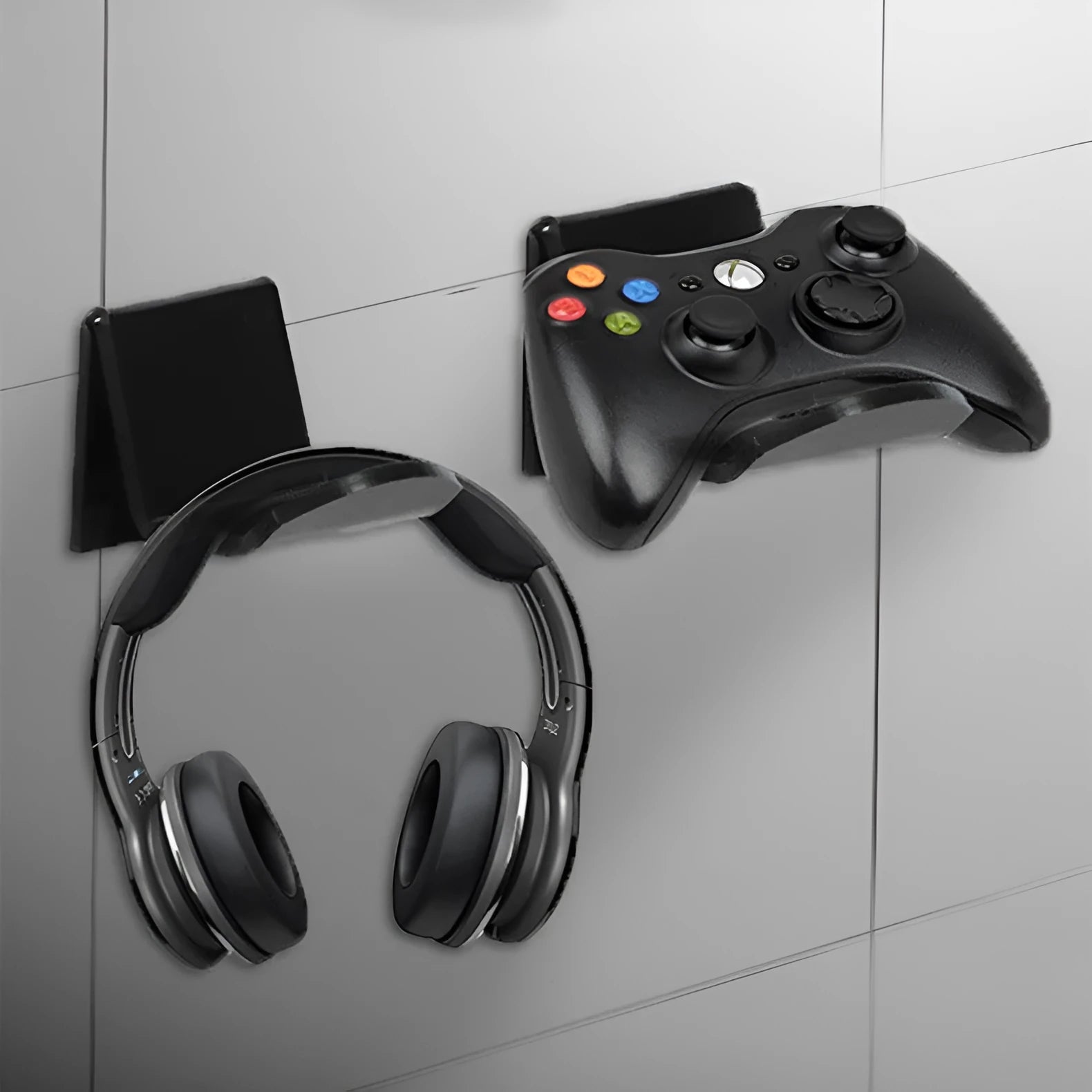 Universal gaming controller wall mounting bracket shown in black, white and transparent colour options