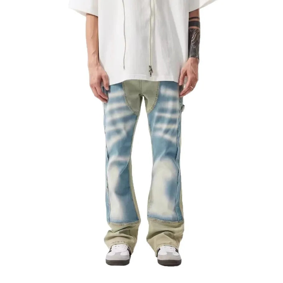 Retro yellow and blue patchwork jeans with splash-ink and damaged design details.