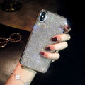 Silver silicone diamond-encrusted phone case for various iPhone models.