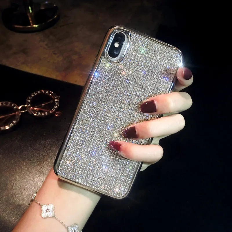 Silver silicone diamond-encrusted phone case for various iPhone models.