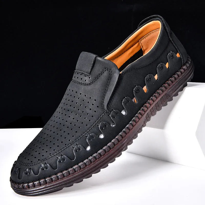 Men's brown slip-on casual shoes with a round toe and flat heel, showing hollowed-out design details.