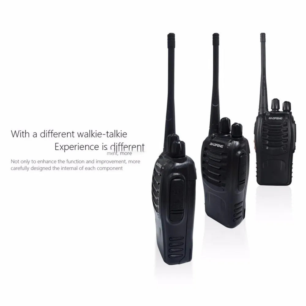 Black BF-888S walkie talkie with antenna and belt clip placed on dark surface