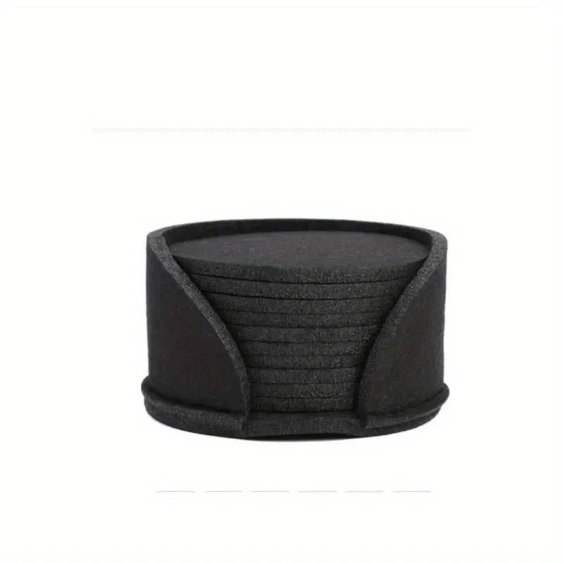 Round felt coaster set of 10 heat resistant drink mats in black, brown, dark gray, and light gray on a wooden table