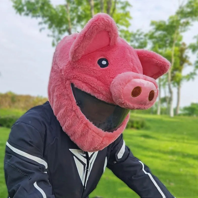Pink pig cartoon design plush hood for wearing under a motorcycle helmet.