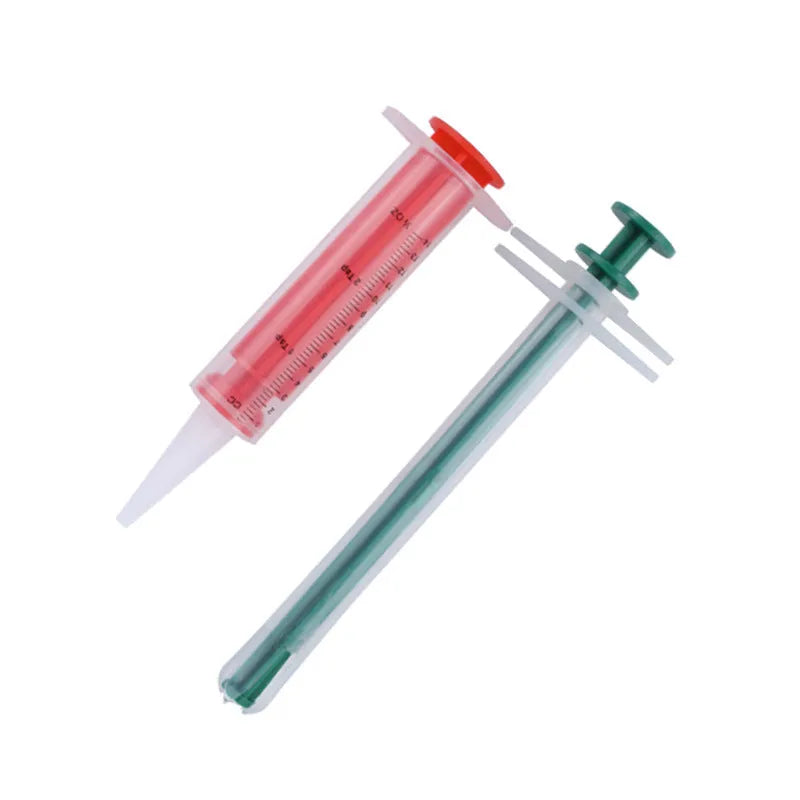 Two silicone pet pill shooters with soft tips for administering tablets to cats and small dogs