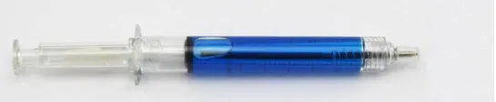 Blue syringe ballpoint pen 12.5cm length on a desk, push-type mechanism visible