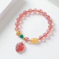 Polished crystal strawberry quartz beaded bracelet in a Nine Tail Fox style for women.
