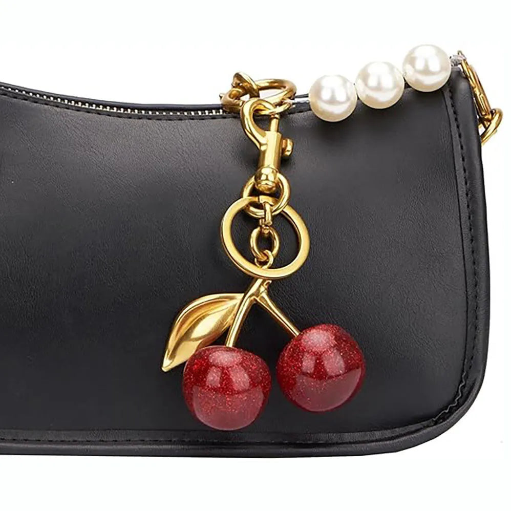 Red zinc alloy cherry-shaped keychain pendant with a three-dimensional design.