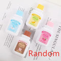 Cute bottle-shaped correction tape dispenser with decorative pattern showing 6m smooth adhesive tape.