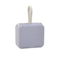 Handbag clip power bank in blue with mobile phone stand function showing charging ports