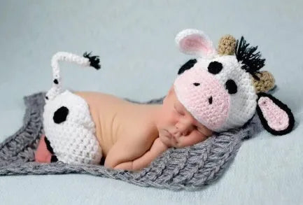 Hand-knitted white baby cow suit set with matching hat and pants for newborn infants