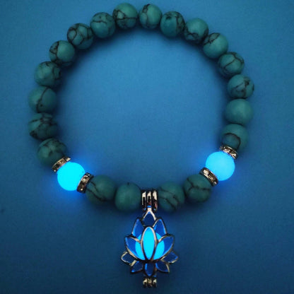 Luminous lotus charm bracelet with mesmerizing glow-in-the-dark beads, made of premium alloy and turquoise fluorescent stone