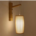 Small woven bamboo pendant lamp with E27 holder, 15cm wide by 35cm high.