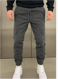 Men's loose fit casual trousers with elastic waistband and dimensional patch pockets in army green colour