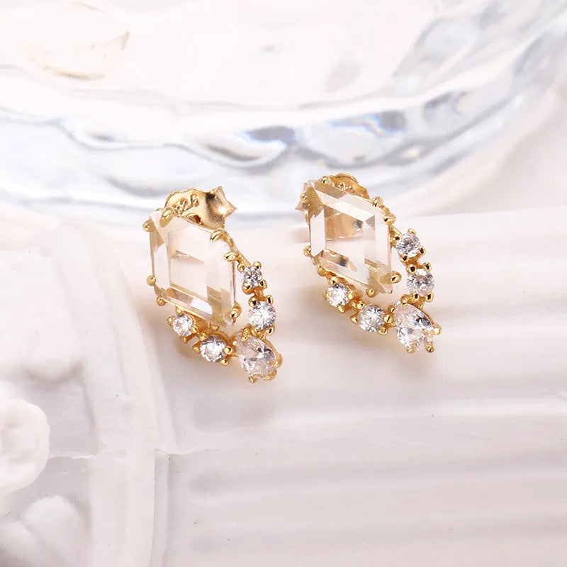 Geometric silver earrings with natural white crystal studs