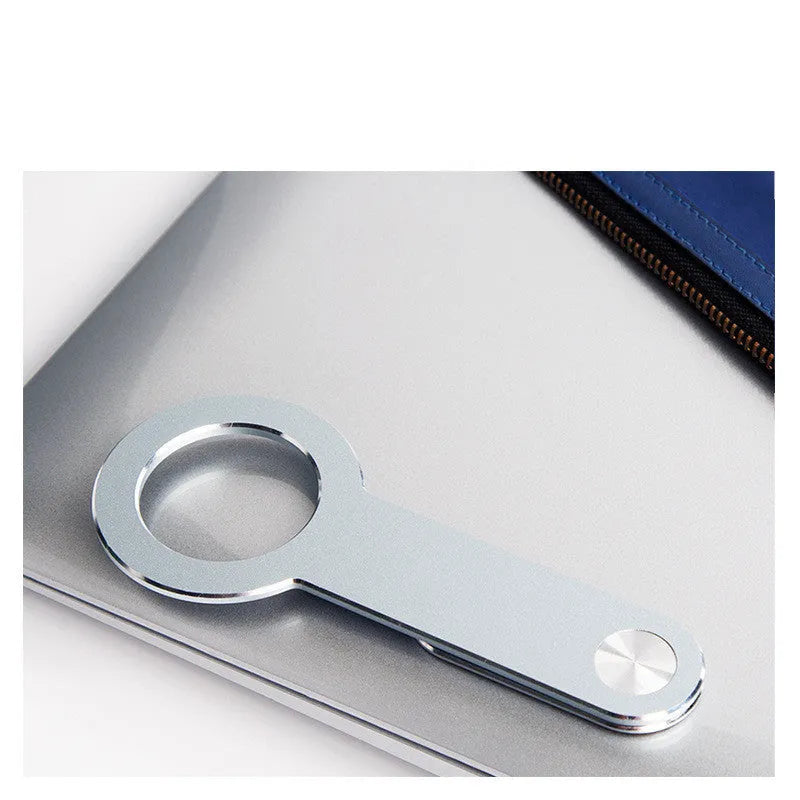 Metallic silver aluminium alloy mobile phone holder for Apple iPhones on desktop