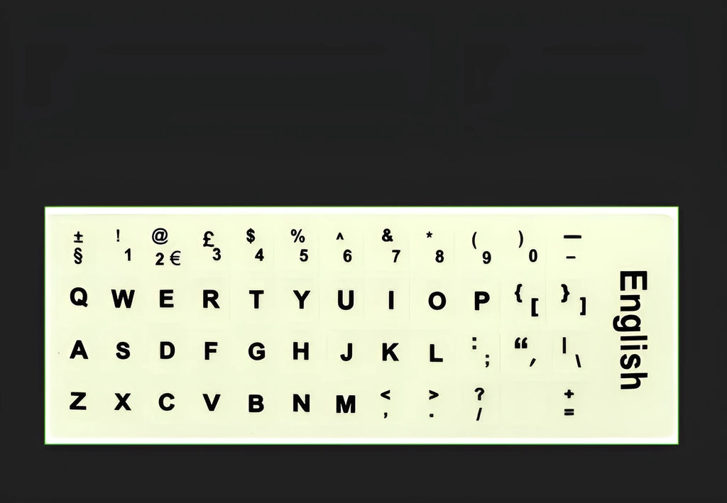 Yellow PVC sheet of glow-in-the-dark keyboard stickers for Arabic, Thai, Hebrew, French, Italian, and German layouts.