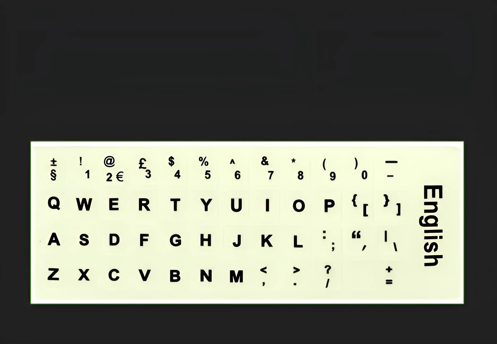 Yellow PVC sheet of glow-in-the-dark keyboard stickers for Arabic, Thai, Hebrew, French, Italian, and German layouts.