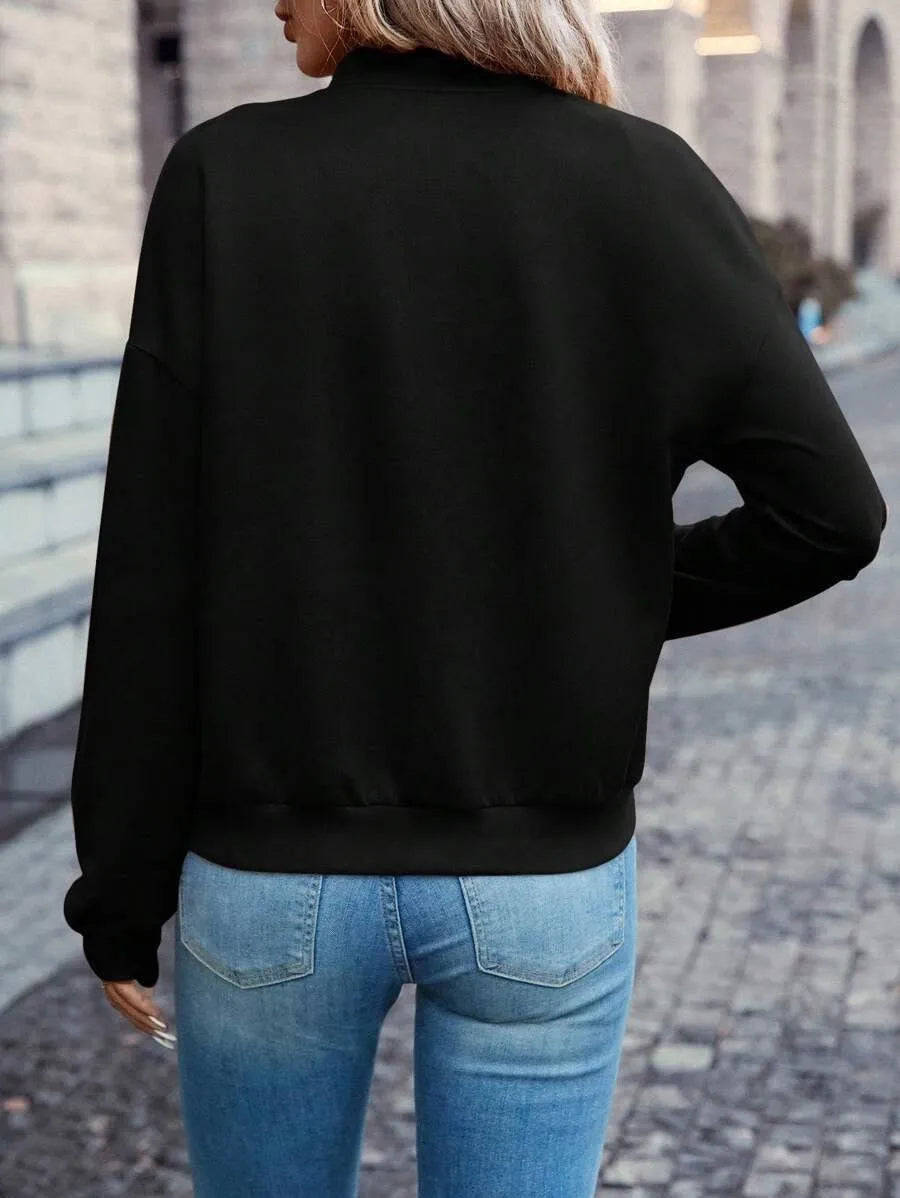 A black women's long sleeve zip-up casual jacket with faux pockets.