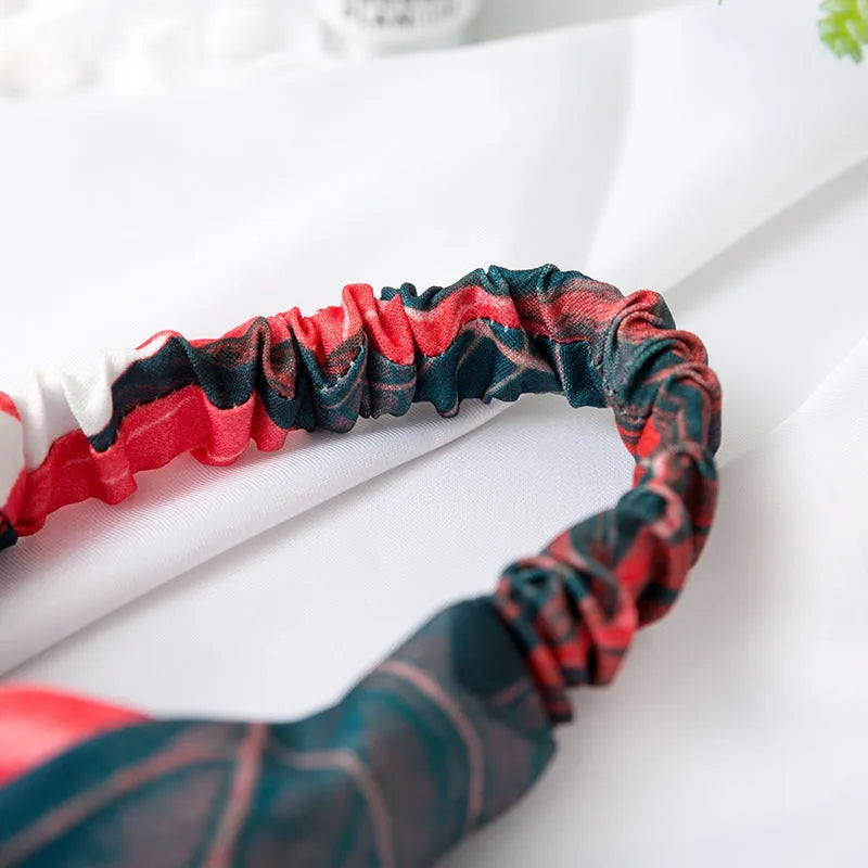 Red cloth women's headband with banana leaf cross pattern design for hair management