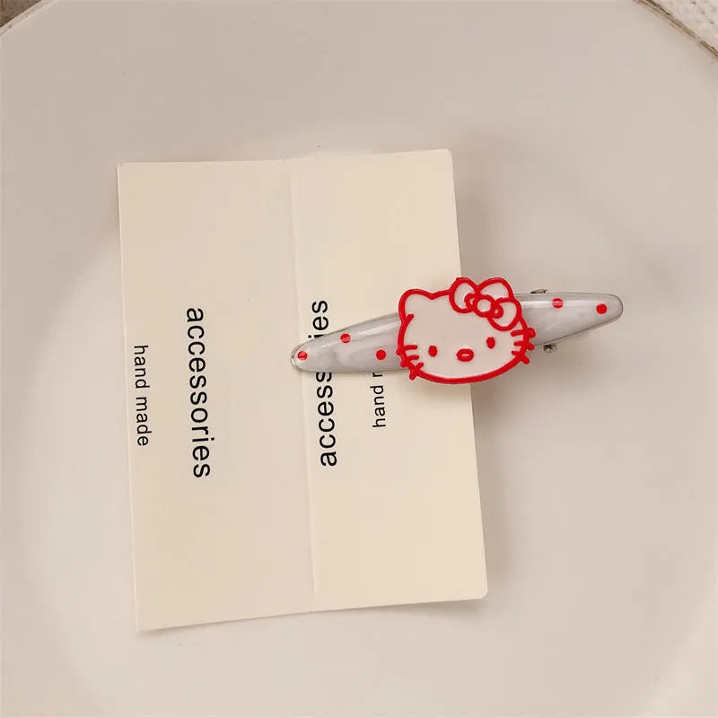 Red love heart shaped hair clip with dotted patterns and willow leaf designs on a barrette