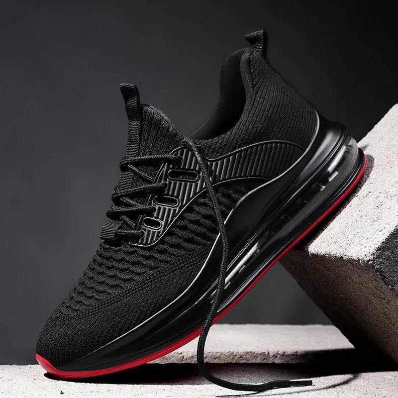 Men's low-top mesh sneaker in black with white sole and lace-up front.