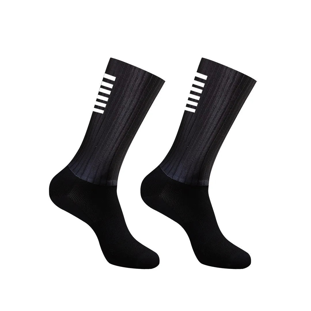 A pair of breathable cycling and running socks in an orange colour on a plain background.