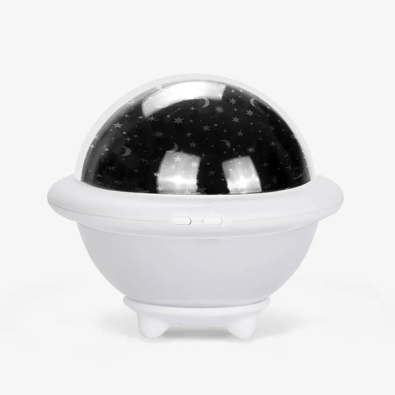 UFO-shaped plastic night light projecting starry sky pattern, available in green, pink, or white