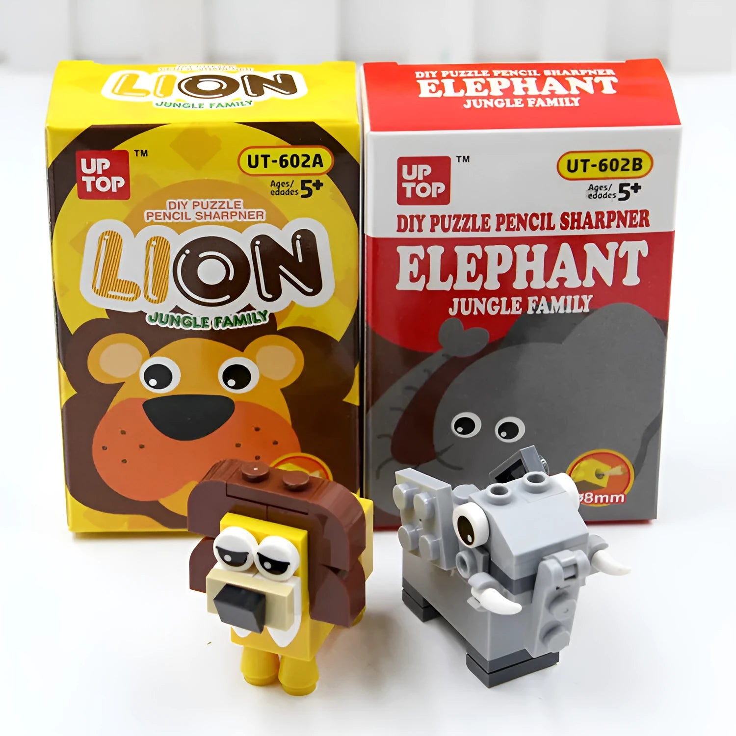 Assembled DIY building block pencil sharpener shaped like an Elephant on a wooden desk