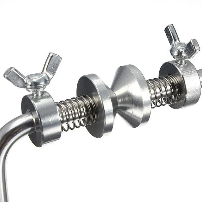 Silver aluminium fishing reel winder with adjustable tensioner and suction cup base on smooth surface