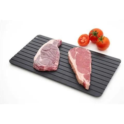 Black aluminium fast defrosting tray for kitchen use on a countertop