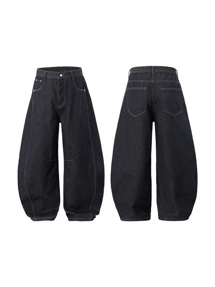 Men's wide leg denim trousers in original cow colour, showing mid-waist and relaxed fit.