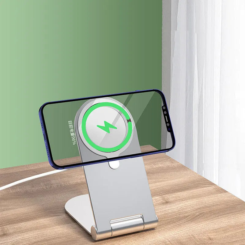 Silver aluminium alloy magnetic bracket holder for iPhone 12 smartphones showing adjustable vertical mounting design