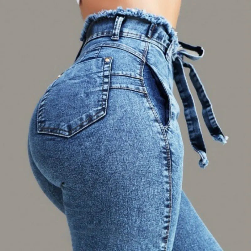 Fringed jeans with distressed detailing and raw hem fringe in cowboy fabric available in three colours