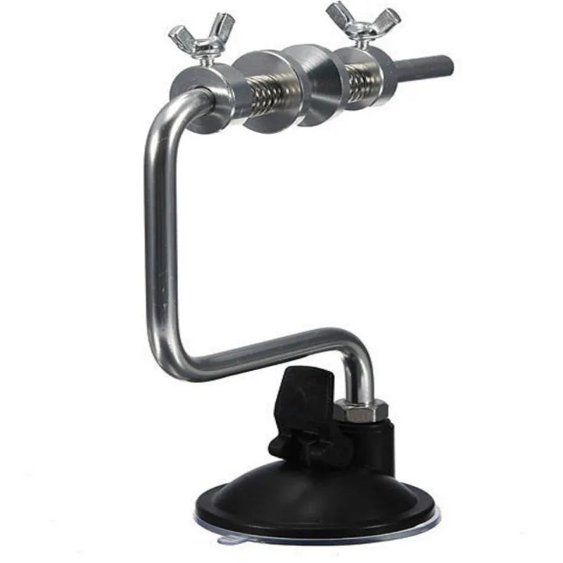 Silver aluminium fishing reel winder with adjustable tensioner and suction cup base on smooth surface