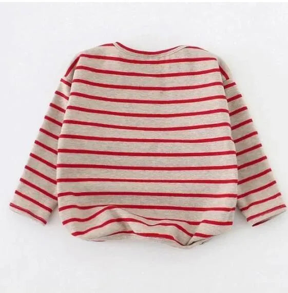 Red and white striped long sleeve cotton t-shirt for a baby girl on a hanger