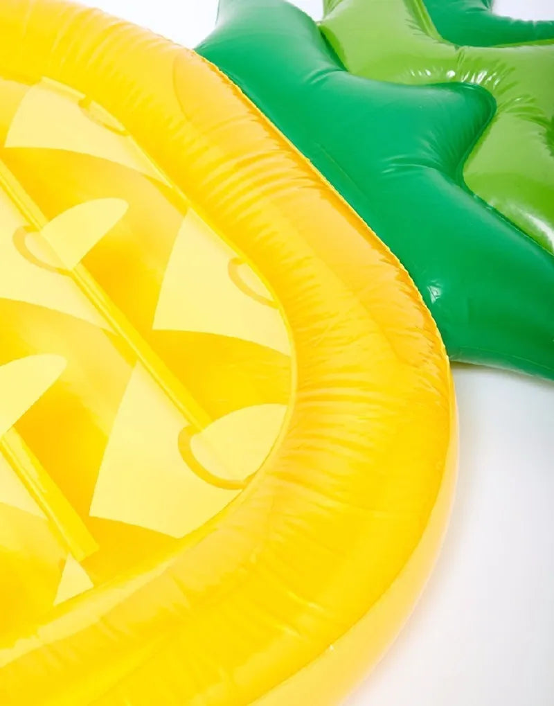 Yellow inflatable pineapple pool float in PVC, foldable floating mattress for summer swimming, beach, and travel