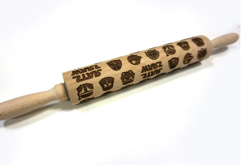 Personalized Christmas rolling pin with a variety of embossed holiday designs, including snowflakes, reindeer, and Merry Christmas patterns