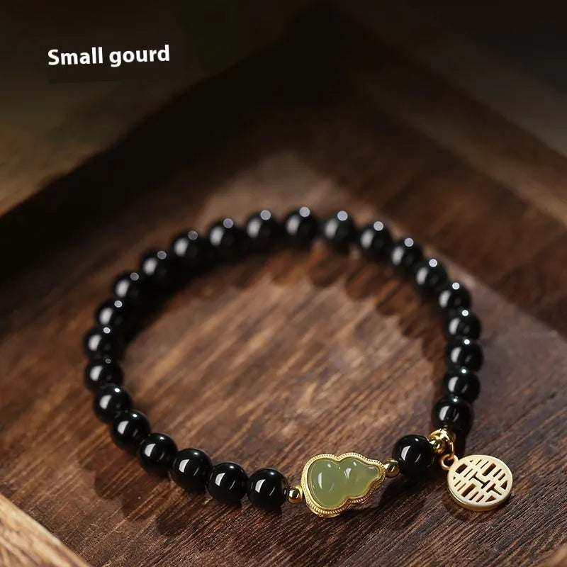 Black obsidian bracelet with Hetian jade gourd charm in geometric pattern