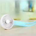 Blue mini USB hand fan with LED light and 200mm blades on a desk