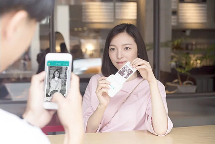 Thermal pocket portable Bluetooth printer in white, 79x79x40mm, with thermal paper roll inside