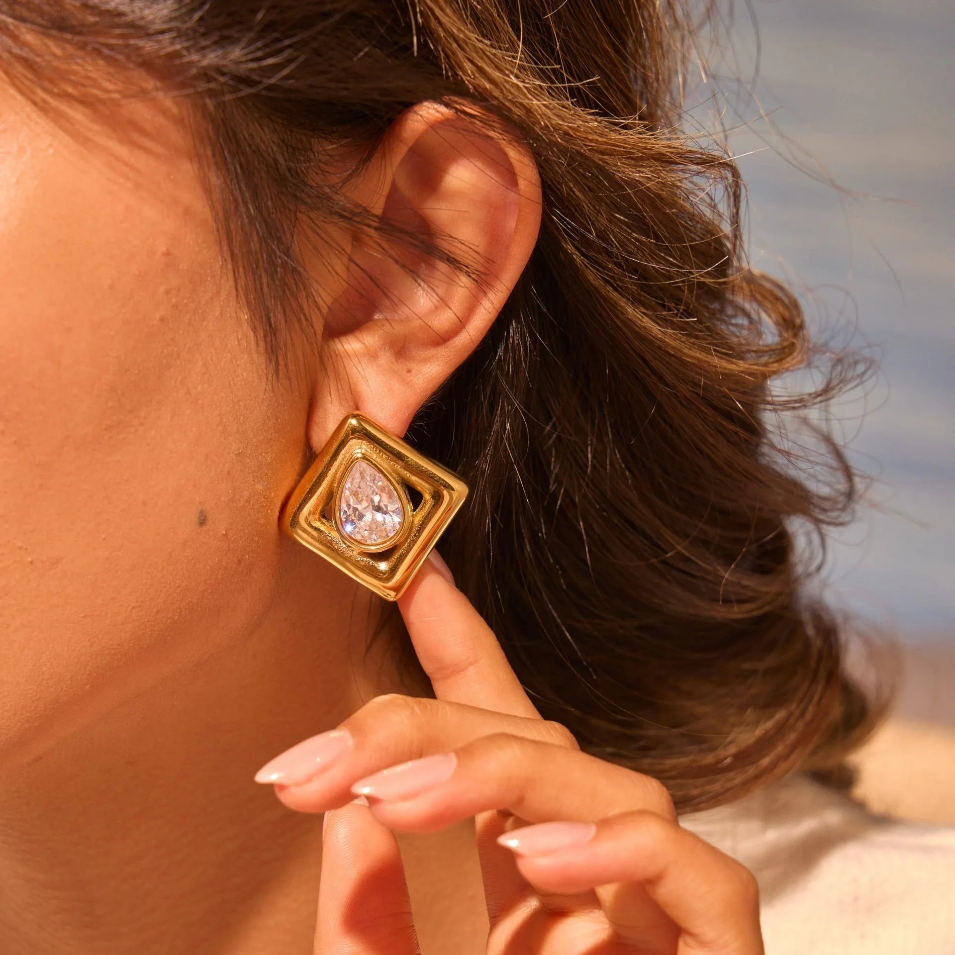 Geometric gold electroplated stud earrings with inlaid water drop zircon stones