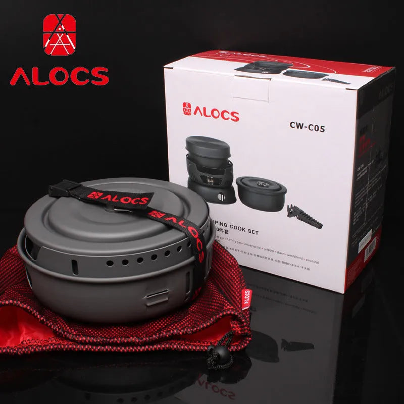 Alocs CW-K26 aluminium non-stick outdoor camping pot set stacked on a wooden table.