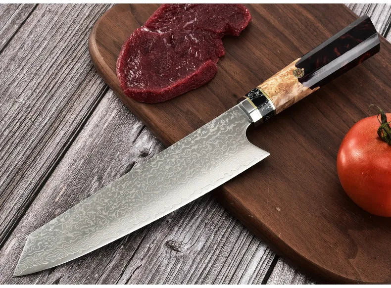 Stainless steel chef knife with 440C blade and turquoise resin handle on cutting board