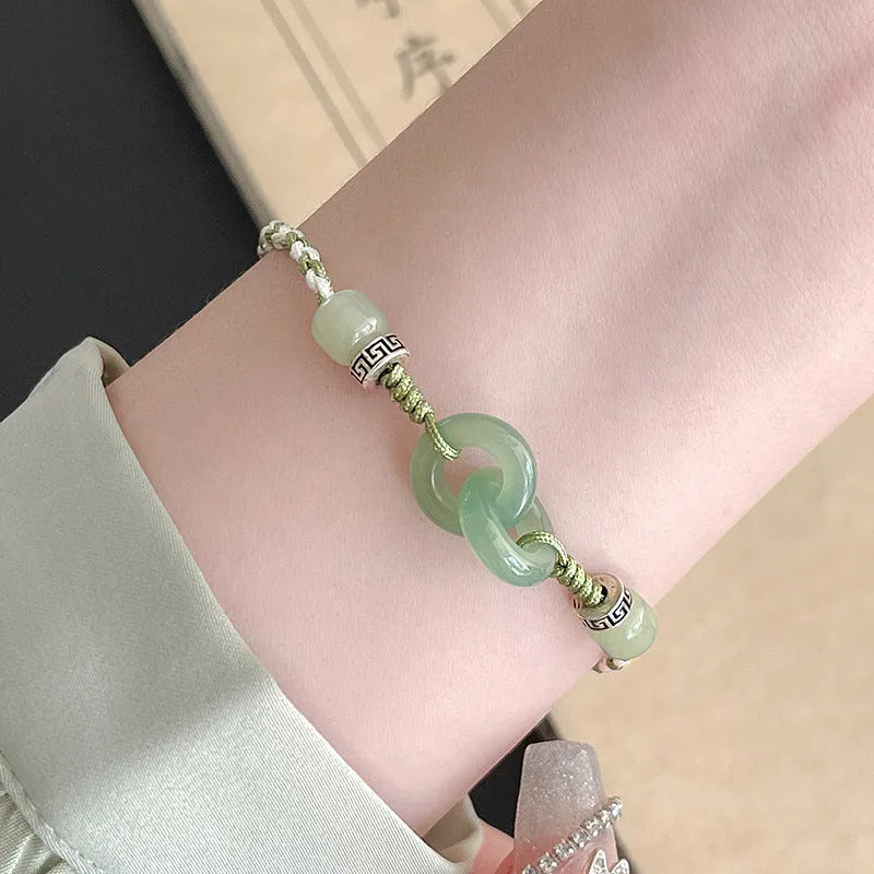 Green copper bracelet with ethnic peace buckle design and jade double ring strap
