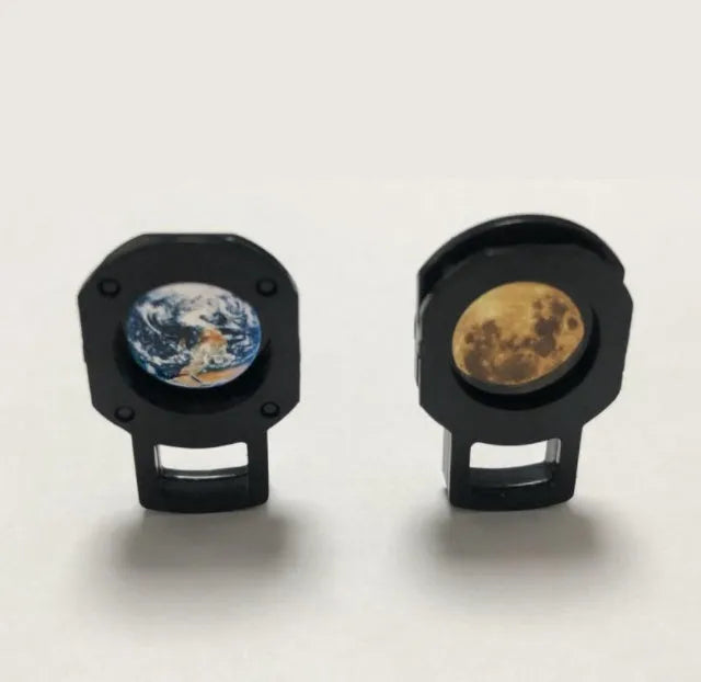 Earth and moon star projection lamp with adjustable hose bracket on a bedside table