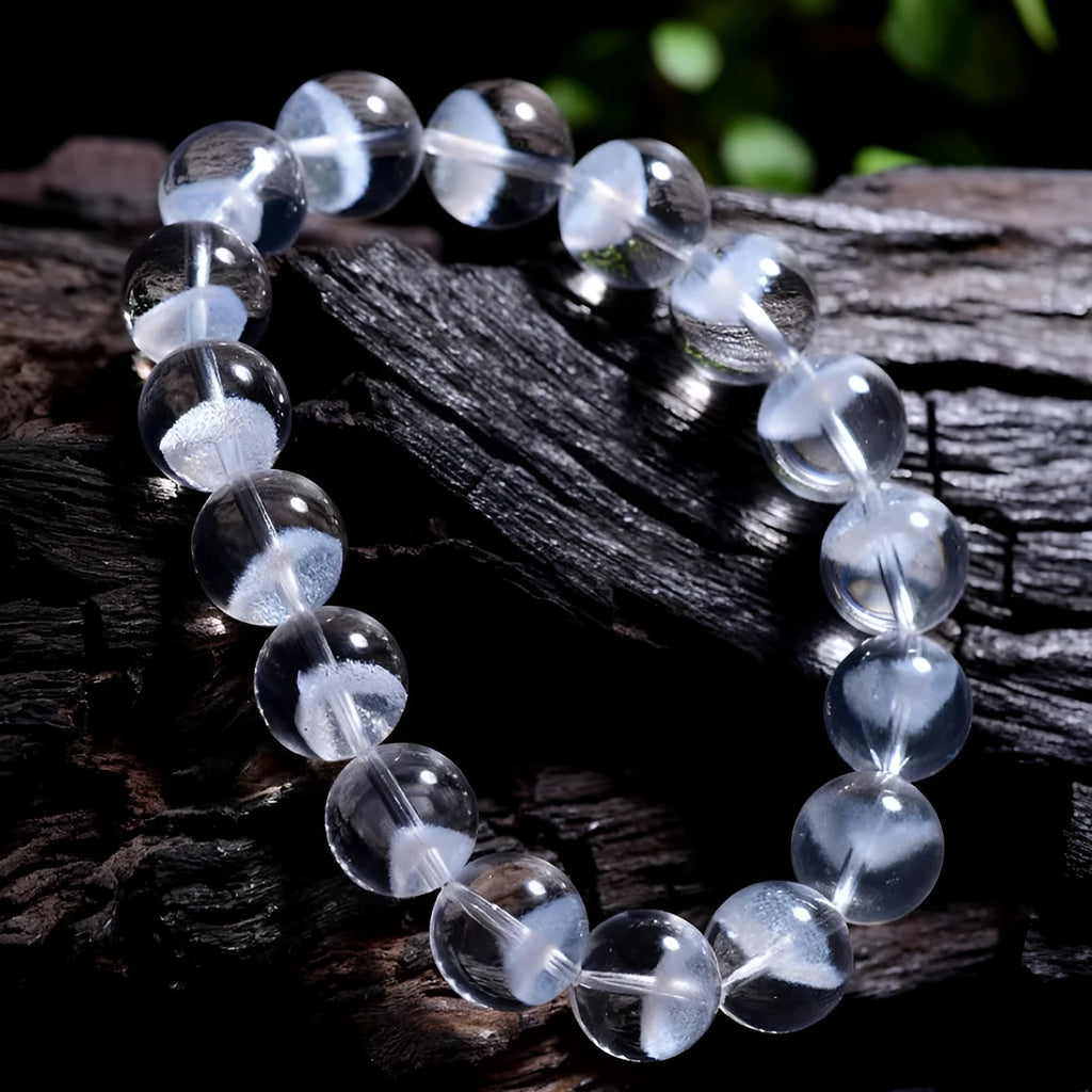 Women's natural white ghost bracelet with a white crystal pyramid charm and ruyi design elements.